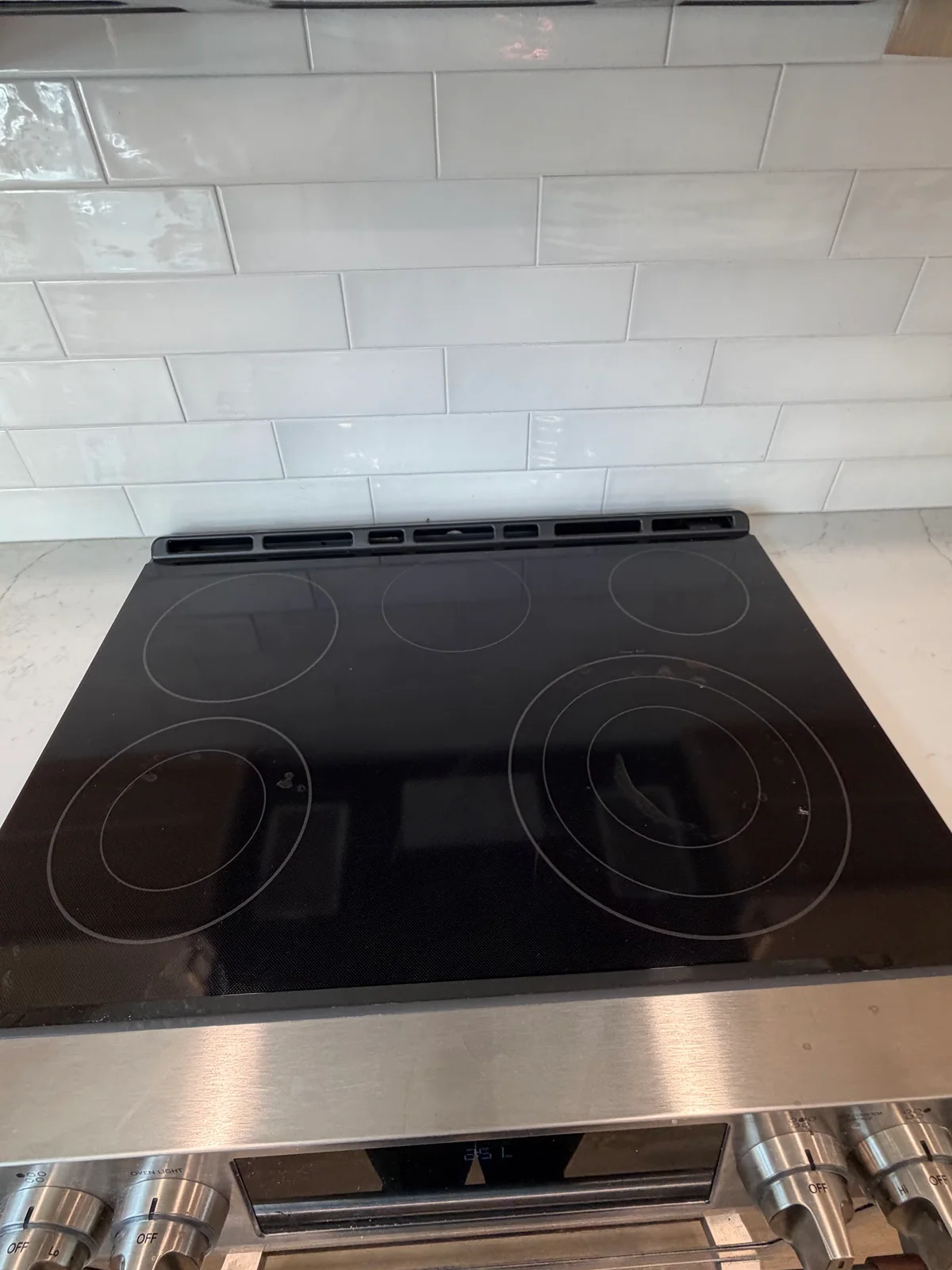 Clean glass cooktop after service