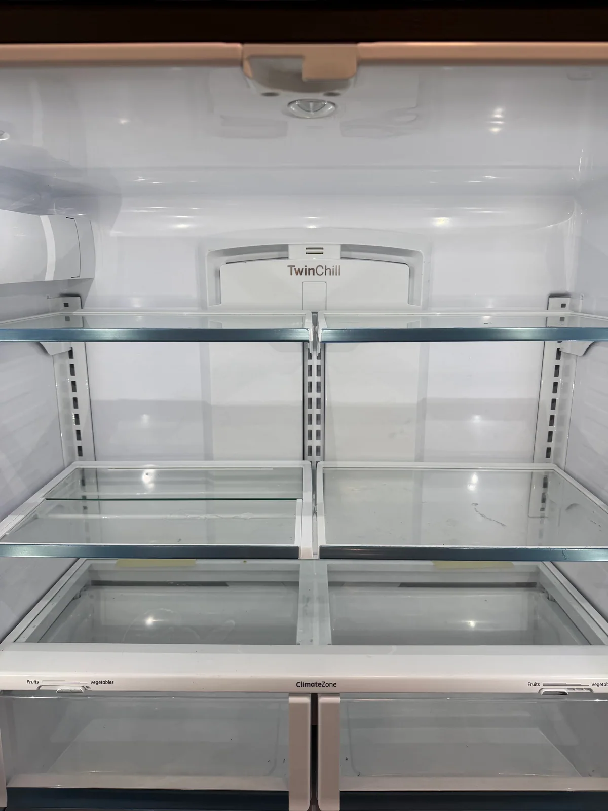 Clean refrigerator shelves after service